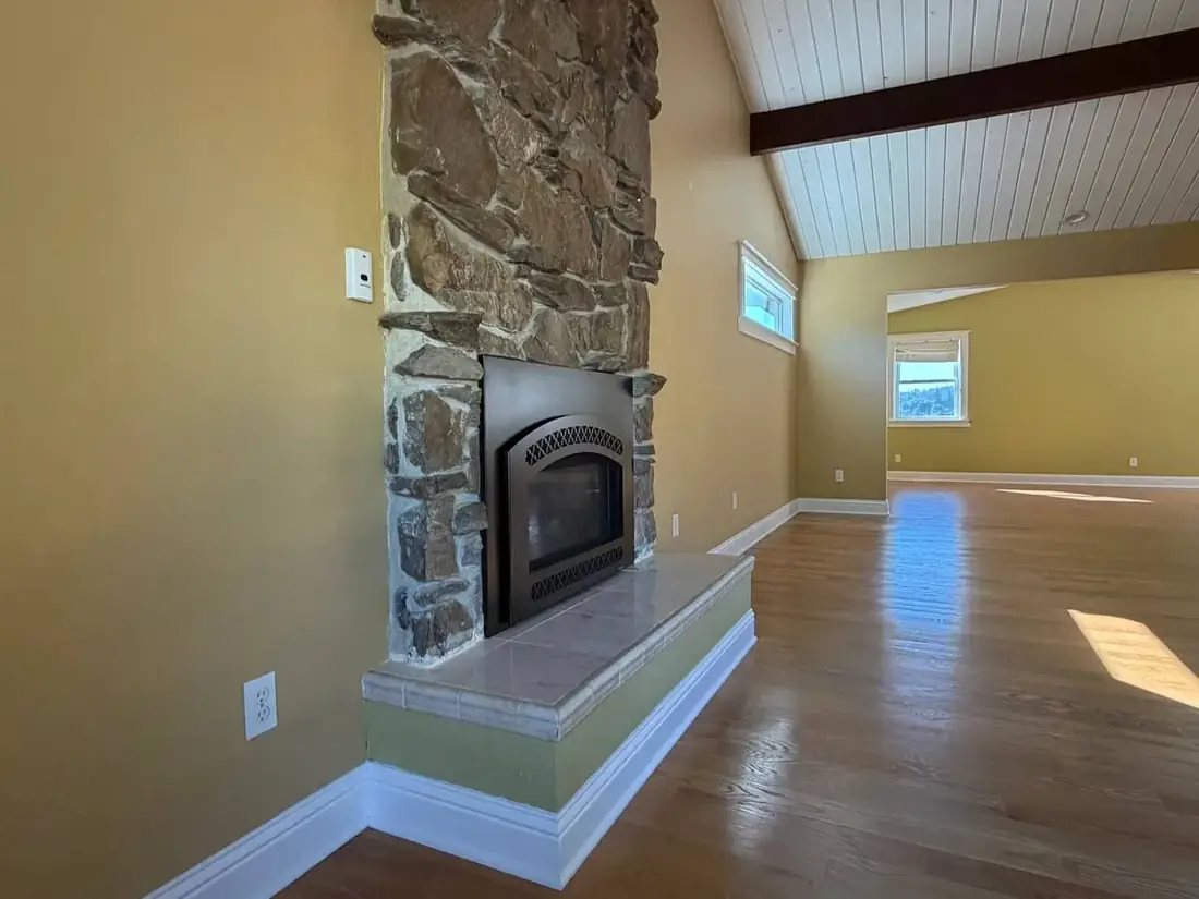 Stone veneer fireplace installation room view Oregon