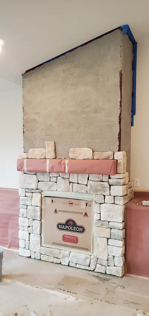 Brick veneer fireplace surround installation in progress Oregon