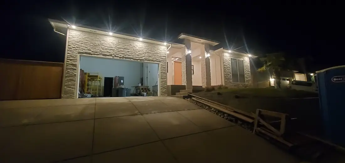 Exterior stone veneer columns on building illuminated at night Oregon